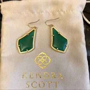 Kendra Scott Alex gold drop earrings in green.